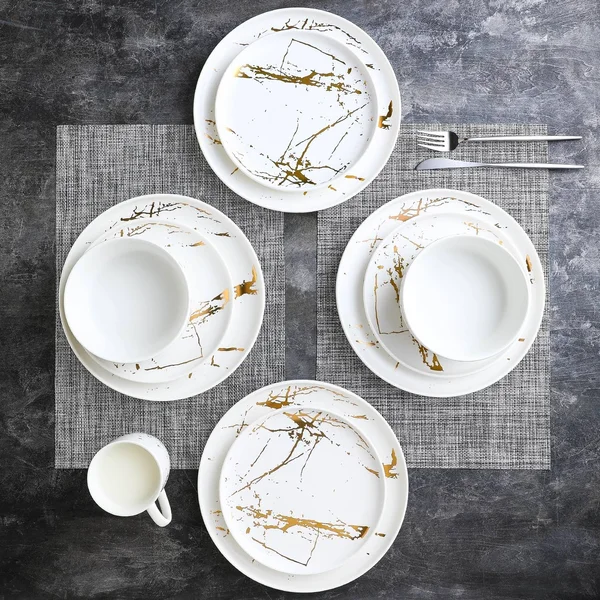 Stone Lain Gold Splash 16-Piece Dinnerware Set in Gold/Black