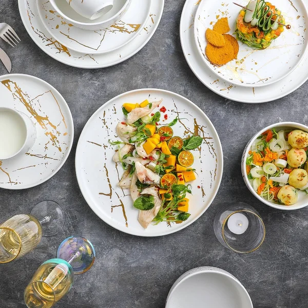 Stone Lain Gold Splash 16-Piece Dinnerware Set in Gold/Black